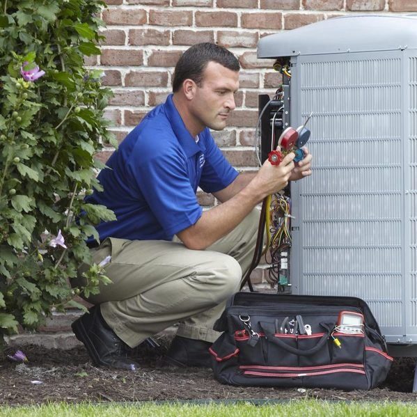 Technician Checking Gauges Outdoor Air Conditioner Unit